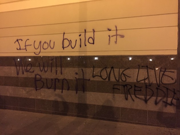 Uber's new Oakland HQ (formerly the Sears building) was tagged on May 1. - JULIA CARRIE WONG